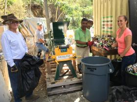 IGLA board members, from left, Vice President Doug White, Gary Ray and President Harith Wickrema, are assisted by volunteers Alice Krall and Carlito Delos Santo in recycling aluminum cans.