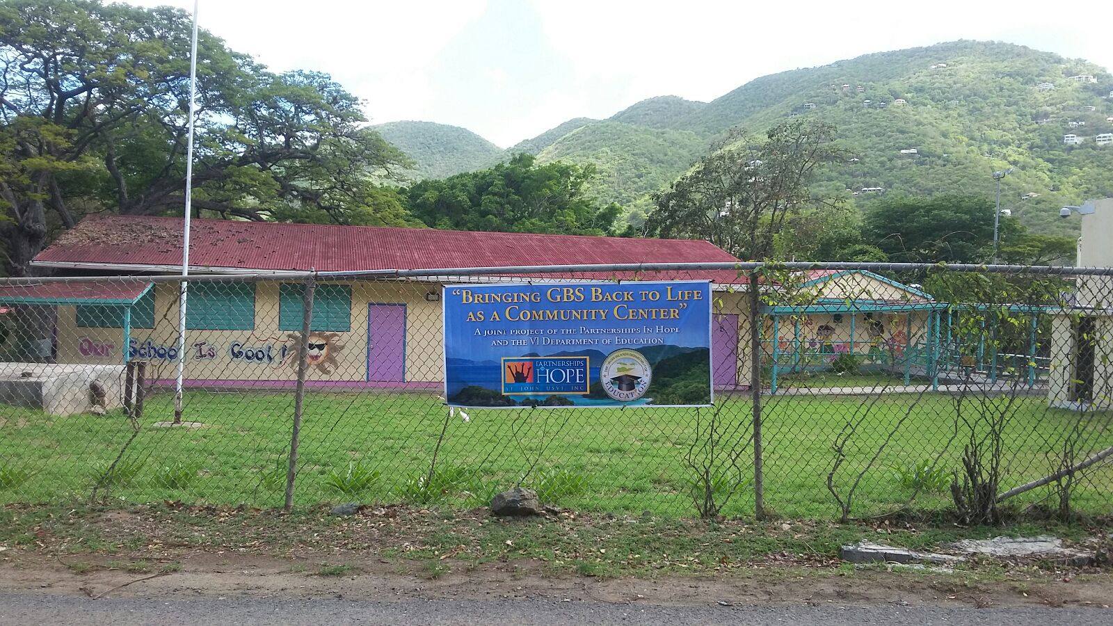 Sign outside Guy Benjamin School in Coral Bay, St. John, announces partnership between the V.I. Department of Education and Partnerships in Hope that transformed the Guy Benjamin School.