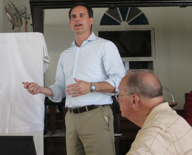 Mark Pirrello of Moffatt and Nichol, standing, and project engineer Bill McComb, explains the planned marina.