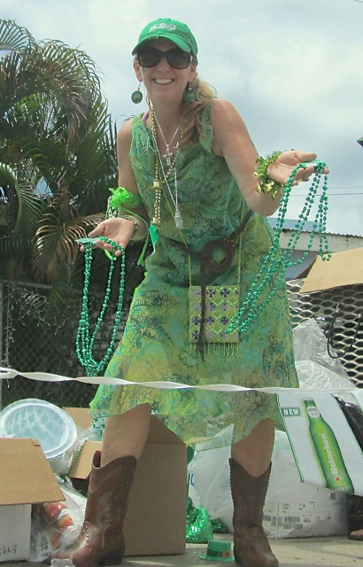 St. John resident Celia Kalousek tosses green beads.