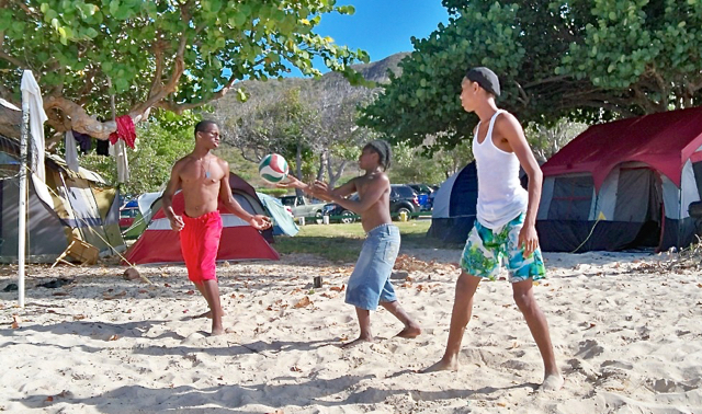 Boys play volleyball at the Unity Camp Retreat at Cramer's Park.