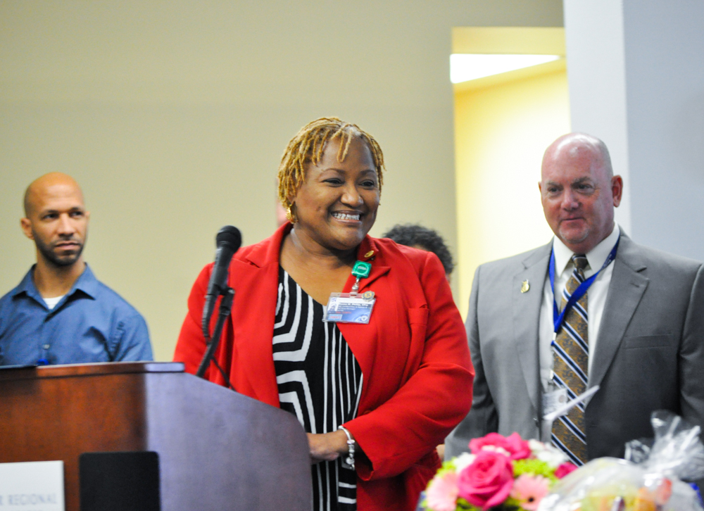 Hospital Week 'Years of Service' master of ceremonies Donna Phillip smiles as she announces the names of SRMC staff members being honored.