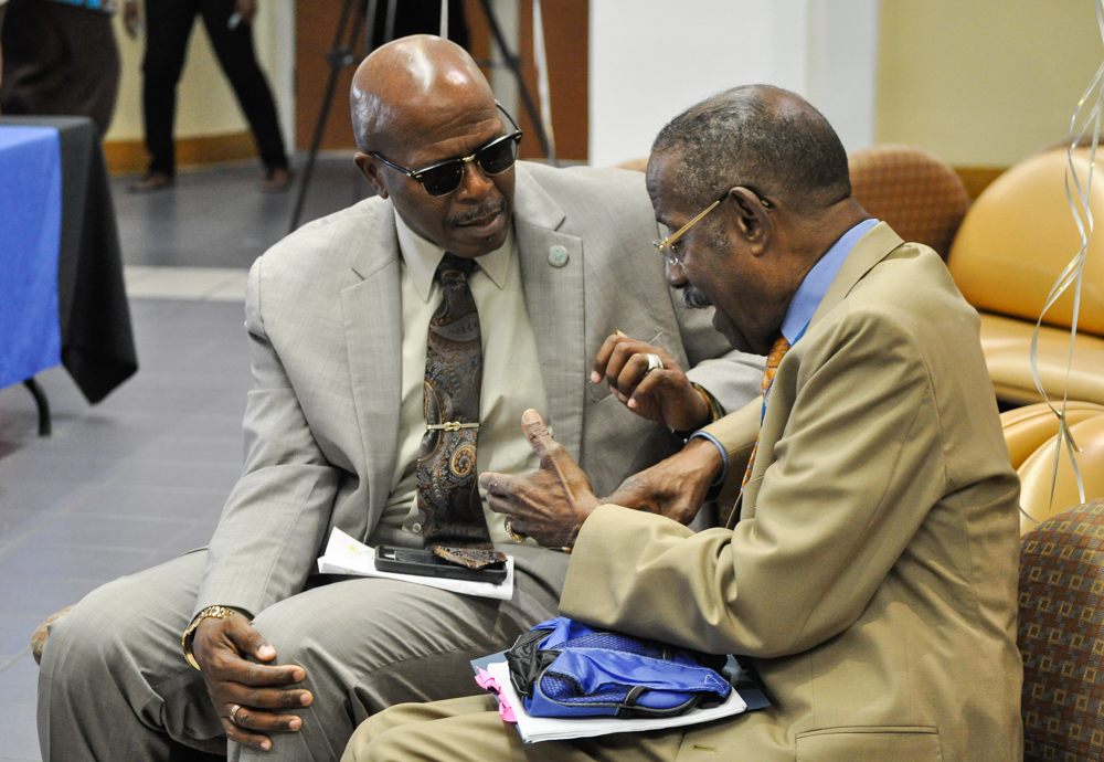 Dr. Alfred O. Heath, right, who was honored for 50 years of service to the community, chats  with old friend Sen. Myron D. Jackson at SRMC.