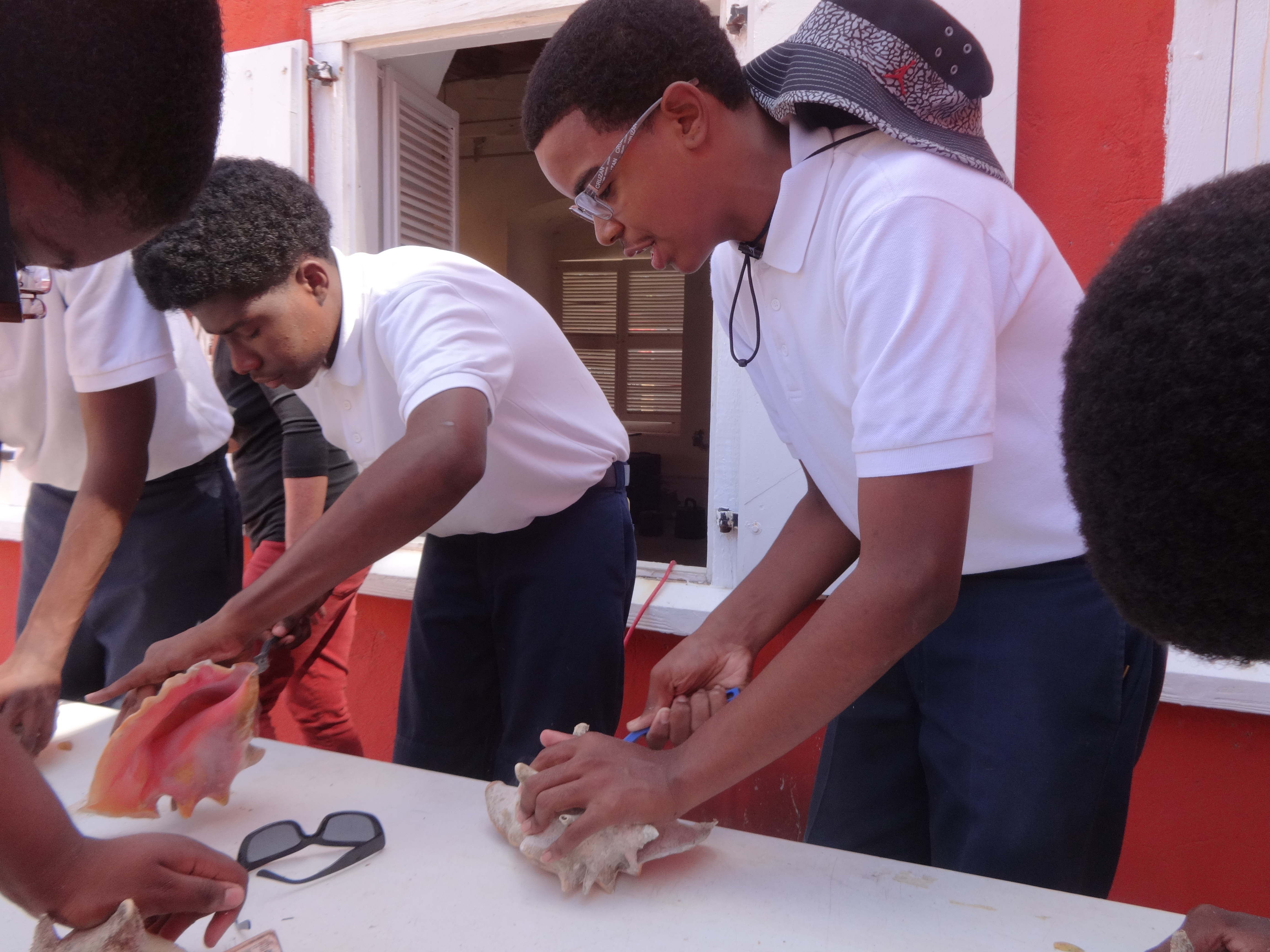 Students from Arthur Richards Middle School learn to make horns from conch shells. (Photos submitted by Opal Palmer Adisa.)