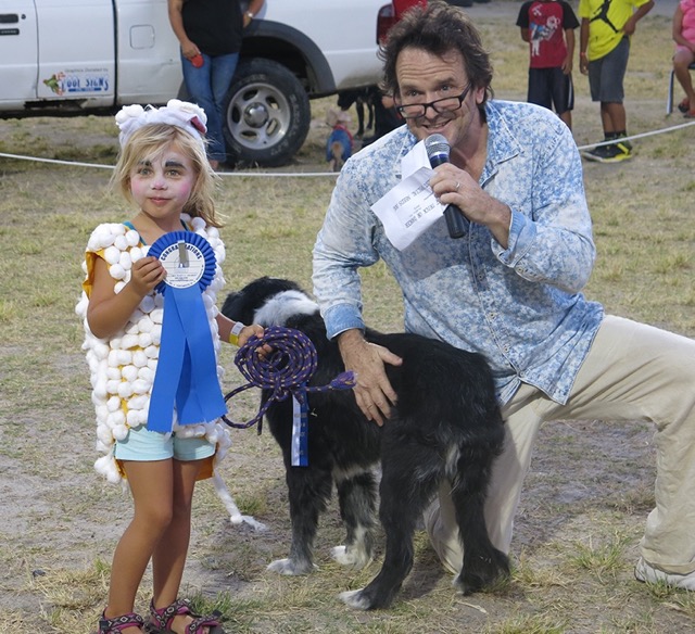 Sheep dog Maddie and her four-year-old owner, Elena Magnie who was dressed like a sheep, captured Best Costume.