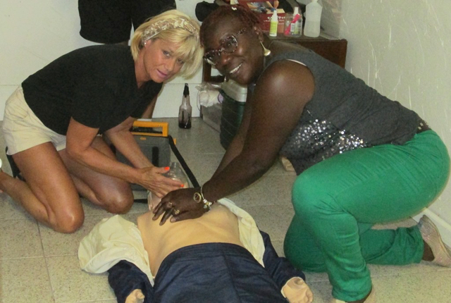Judy Sinnamon and Stephanie Christian practice CPR at St. John Rescue.