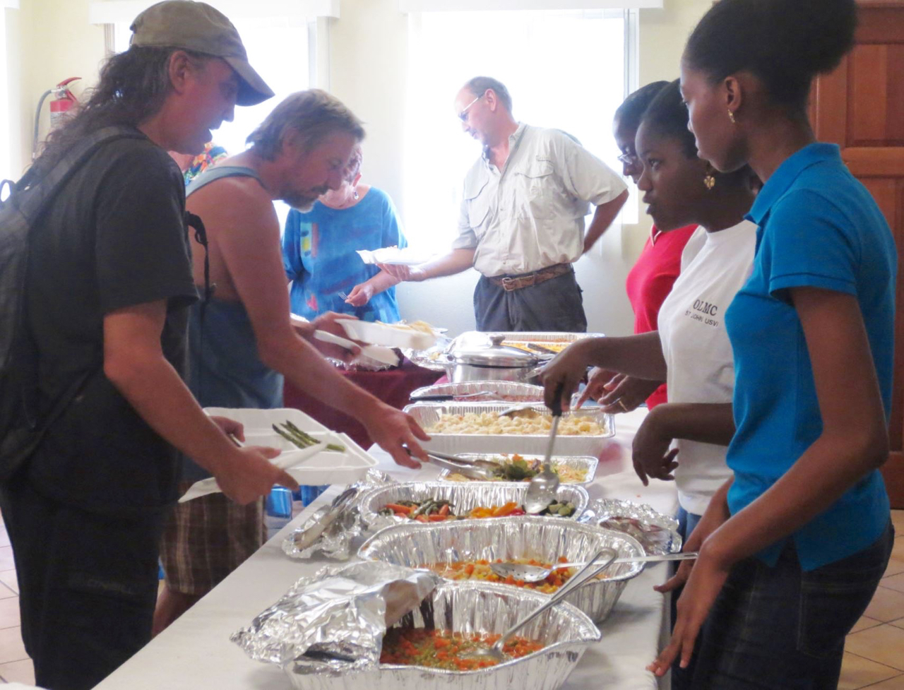 Voluneers serve a Thanksgiving dinner. (Photo provided by Our Lady of Mount Carmel)