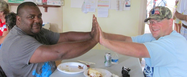 James Davis of Pickering, Ohio, and Ahmad Peterson of Orlando, Florida, celebrate their kayaking success over lunch.