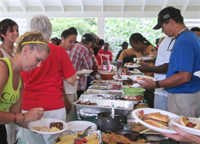 Team River Runner and community members line up for a lavish lunch.