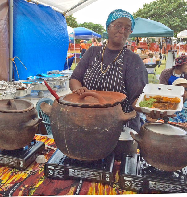 Judy Ottley dishes up food at the Ag Fair Saturday.