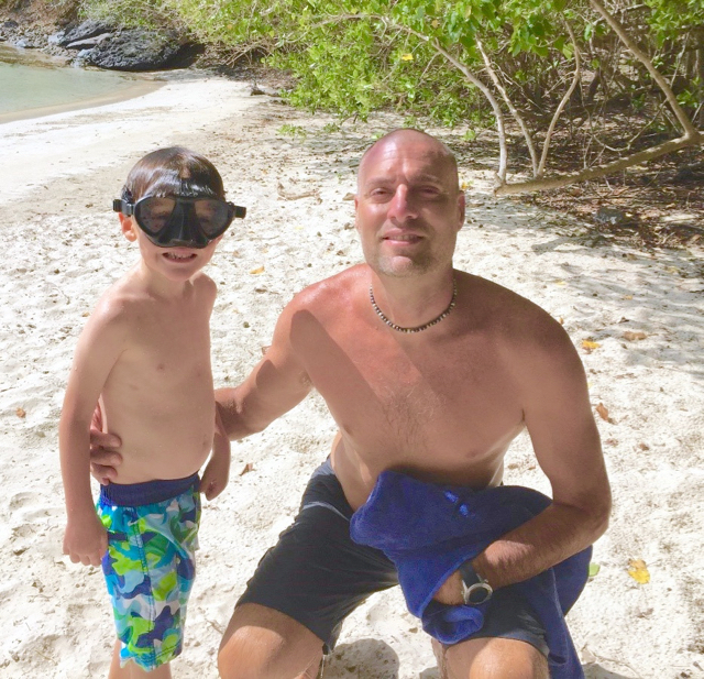 Rob Tutton and his son Teak on a St. John beach.