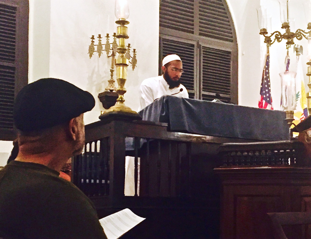 Imam Abubakar Mohammed of the Nur Islamic Center of St. Thomas addresses the 'Shabbat of Solidarity' on Friday evening.