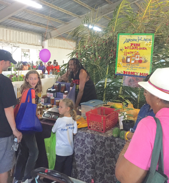Fairgoers purchase honey from Virgin Island Pure Wild Flower Honey at the 2016 Agrifest on St. Croix.