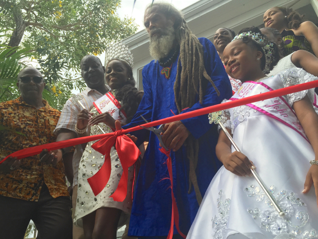 Food Fair honoree Delroy 'Ital' Anthony cuts the ribbon at the fair&rsquo;s opening ceremony while 2016 Festival Queen Steffi Nicholas, Festival Princess Akahi&rsquo;ya Heywood, Sen. Myron Jackson and St. John Administrator Camille Paris look on.
