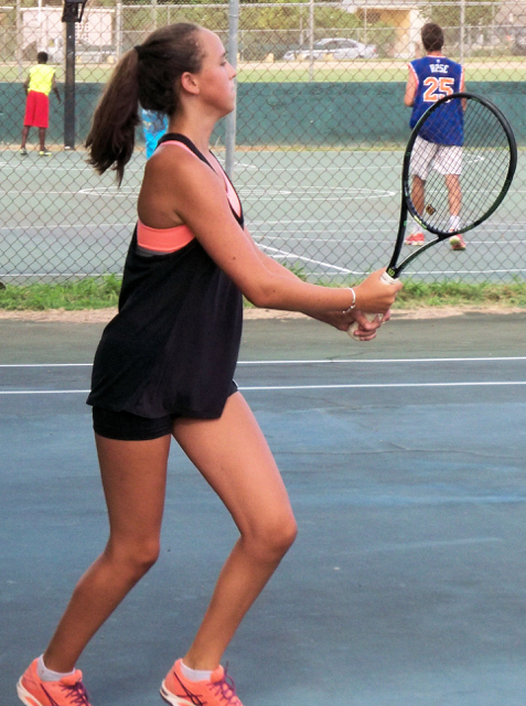 Ava Neuburgher-Highby follows through on a backhand.