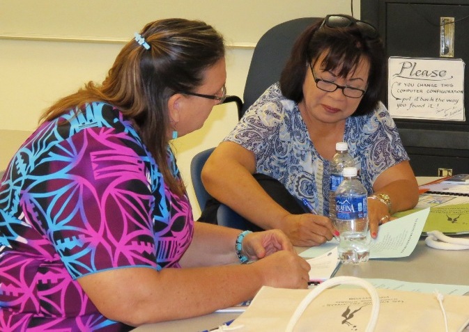 American Samoa educators -- Atalina Coffin (left) and Netini Sene -- work on developing common educational strategy for the U.S. Outlying Areas at V.I. PEN Conference May 10 at UVI campus, St. Croix.