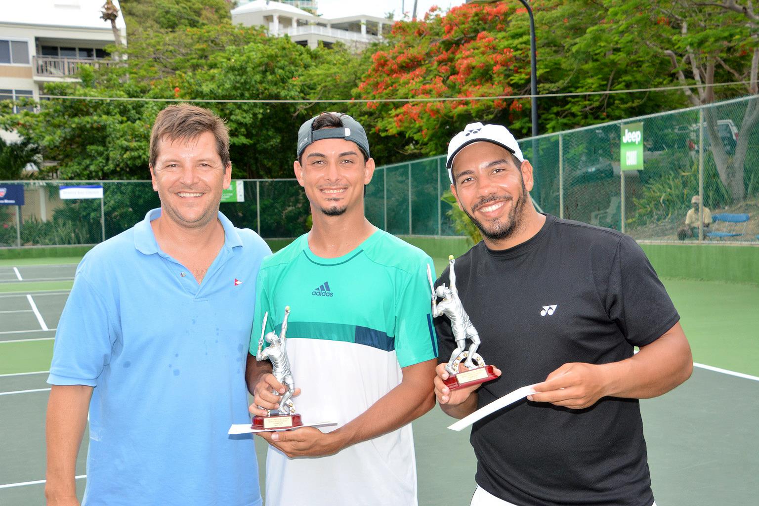 L to R -- Dan Nicolosi, commodore of the St. Thomas Yacht Club, Erwin Lopez and Fernando Negron, Mens Open Doubles winners. (photo by Dean Barnes)