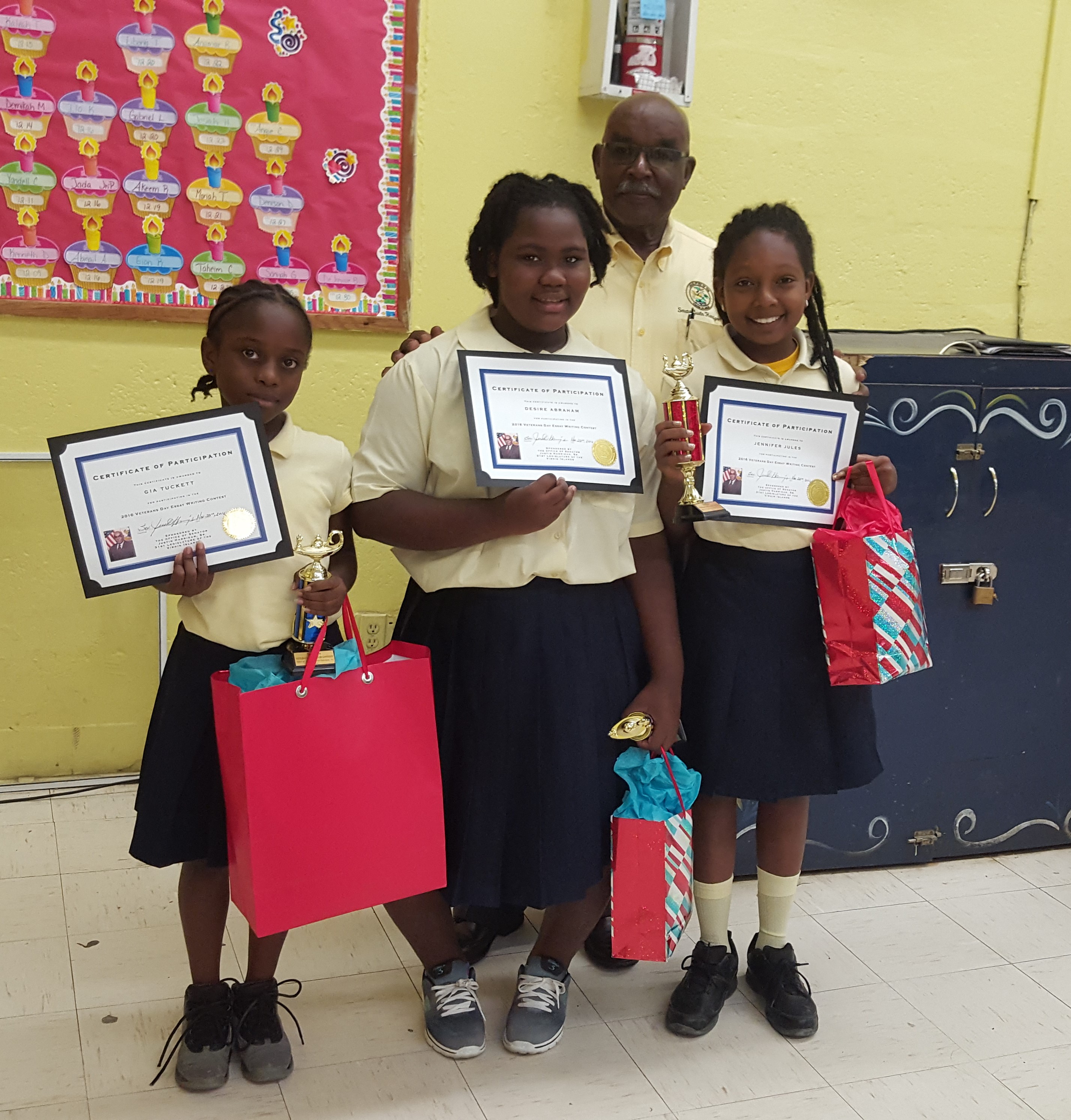 The senator with the 1st, 2nd and 3rd place winners of Sprauve School