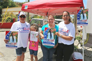 Janelle Sarauw supporters campaign outside the Charlotte Amalie High School Saturday morning.