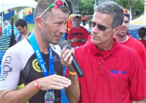 Francky Favre talks to Dave Ragsdale Sunday after winning the 29th – and final – St. Croix Ironman in a tie of 4:42:07.