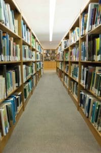 Full shelves look down on empty aisles at the Turnbull Library, which is closed while the air conditioning system is repaired.