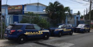 Police cars line up in front of the Julius E. Sprauve School 