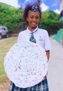 Student members of Island Glory Crafts, a Junior Achievement company, turn plastic shopping bags into braided mats. (Submitted photo)