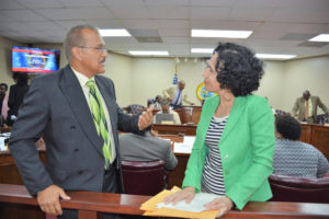 Pedro Cruz, commissioner of Sports, Parks and Recreation speaks with Sen. Nereida Rivera-O'Reilly during a break in Wednesday's budget hearing.