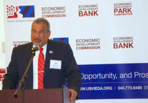Wayne Biggs Jr., head of the EDC, addresses the business summit Tuesday.
