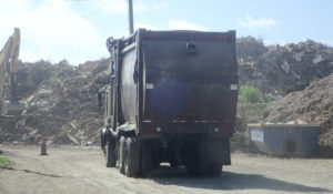 Truck hauls trash at St. Croix's Anguilla landfill recently (Susan Ellis photo)