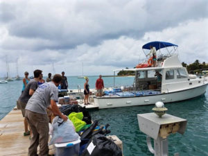 Crucians help load Matt Ridgeways boat with supplies for St. Thomas. (Photo from Facebook)