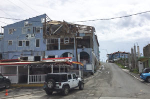 The streets of St. John are getting cleared of debris, but St. John still bears the scars of hurricane daamge.