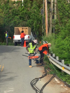 Crews working for Viya cut up old cable for recycling.