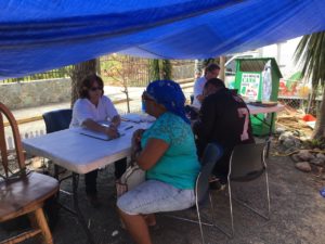 FEMA workers sign upo residents for the Blue Roofs project.