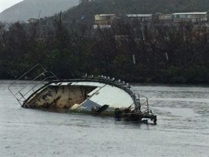 A sunken boat lies in the water off St. Thomas. 