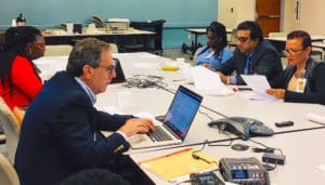 Attorney Loren Kleeger, Health Commissioner Michelle Davis, Dr. Olivine Anne Treasure and Wanda Ruben, CEO of JFL, discuss FEMA loans with territorial hospital board members on St. Thomas.