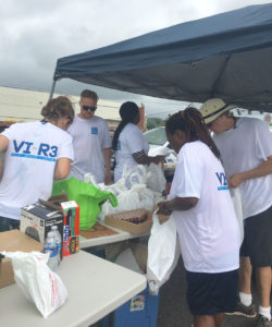 Volunteers package batteries for distribution Saturday at the VI-R3 event.