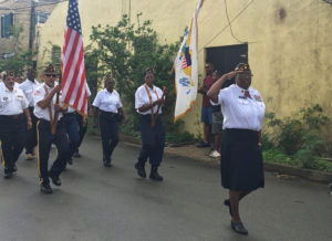 Crucian veterans march through Frederiksted Saturday in honor of Veterabs Day.