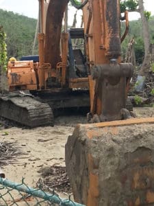 The earth-moving equipment at Hull Bay Hideaway appears to be using beach sand for filler.