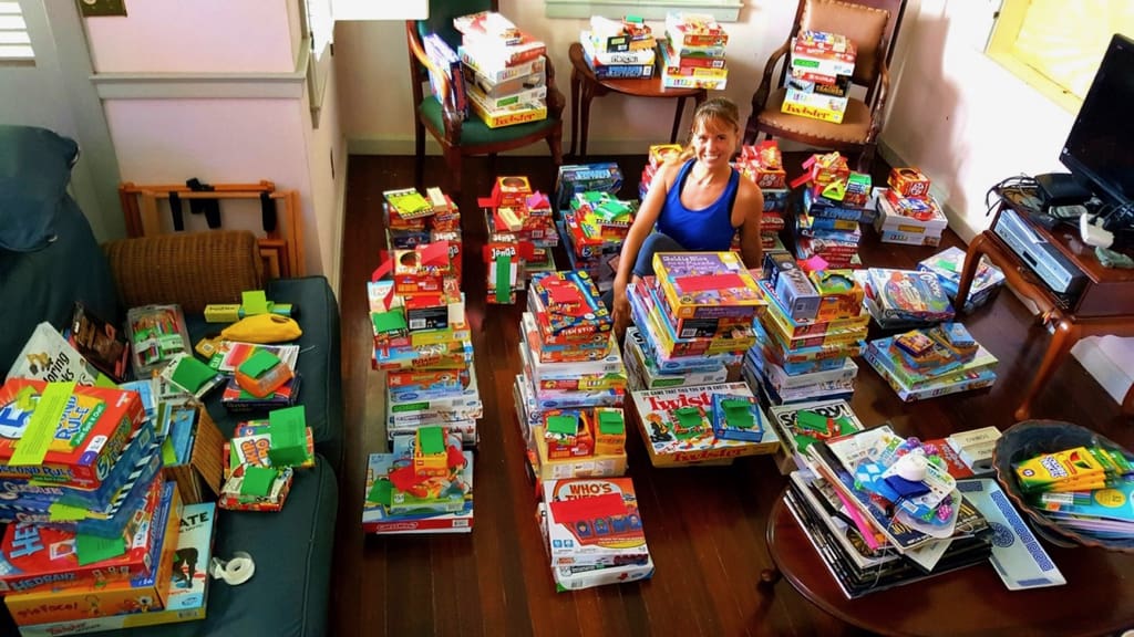 Jessica Parker, somewhere int he middle, stacks her livingroom with games.