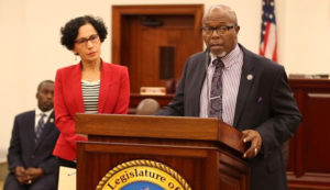  Senate President Myron Jackson, flanked by members of the Majority Caucus, speaks about the Senate's contributions to hurricane relief efforts.
