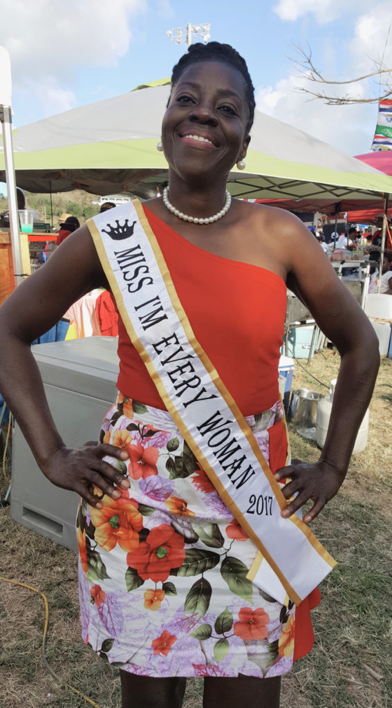 Nemmy Williams-Jackson, Miss I’m Every Woman 2017, poses for a quick photo near busy vendors. (Ivy Hunter photo)