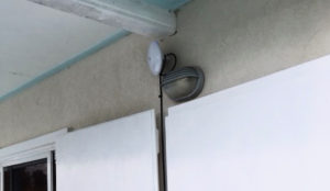 The NanoBeam, the white bulb-like object above the gray porch light, points at a LCCN distribution point.