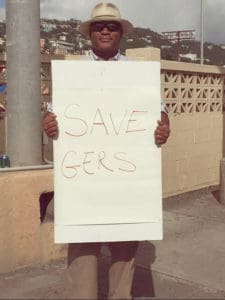 Sen. Brian Smith makes his silent protest at the Emille Griffith Ballpark.