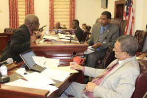 Sens. Neville James, Kurt Vialet and Jean Forde at a Committee on Finance hearing Tuesday.