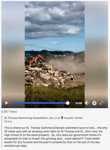 A screenshot taken from a Facebook video post shows dust from a hurricane debris processing site next to the outdoor pool at the St. Thomas Swimming Association, Inc.