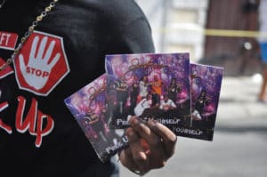 A street merchant offers CDs from a Virgin Islands band. (David Knight photo)