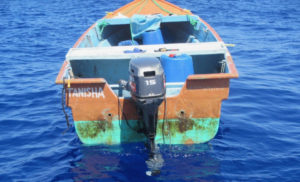 Eight men and three women were taken from this 19-foot vessel in the Mona Passage. (U.S. Coast Guard photo)