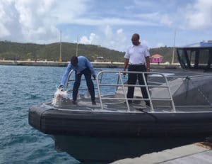 The Rev. Errol L. Connor christens the George Elwin Freeman, Sr. pilot boat, accompanied by representatives from VIPA.