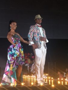 A couple dressed in color-coordinated designs from Posh Boutique.